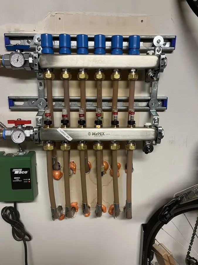 Plumber performing Gas Line Installation at a residential property in Chamberlayne